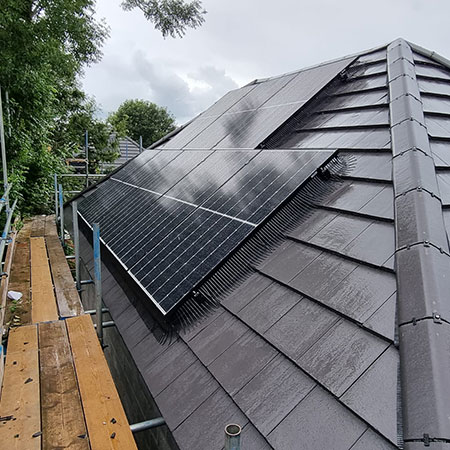 Solar panels installed on home on a rainy day